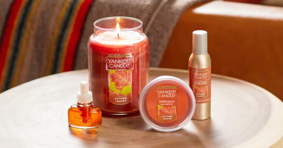 Yankee Candle Autumn Leaves products on coffee table