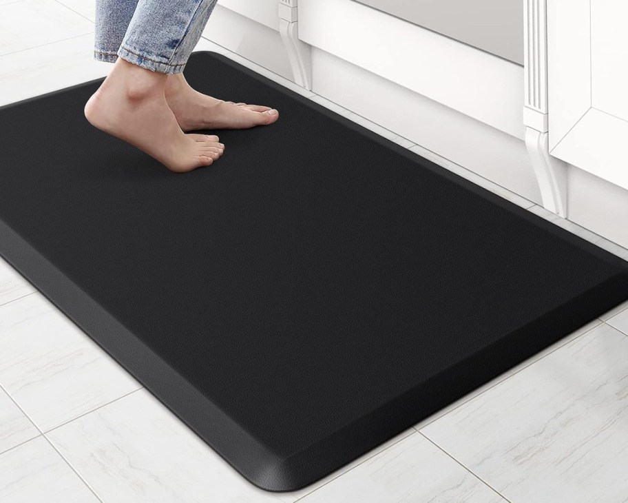 feet standing on non slip mat