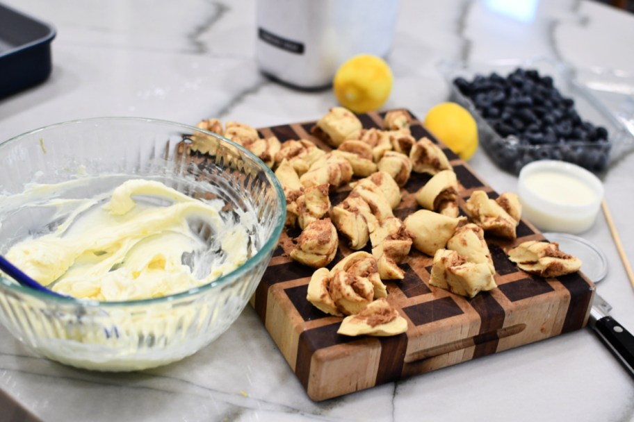 chopped cinnamon rolls on a cutting board