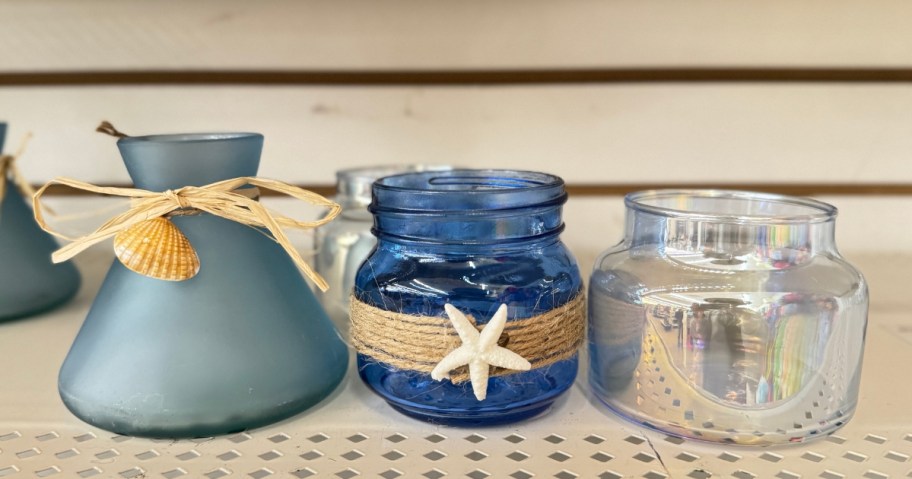 frosted blue sea glass, bright blue and mercury glass coastal candle holders on shelf