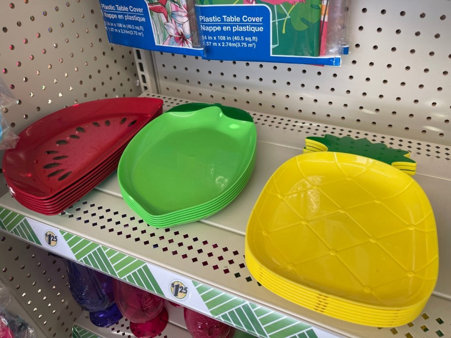 fruit shaped plates, pineapple, lime and watermelon slice on a shelf