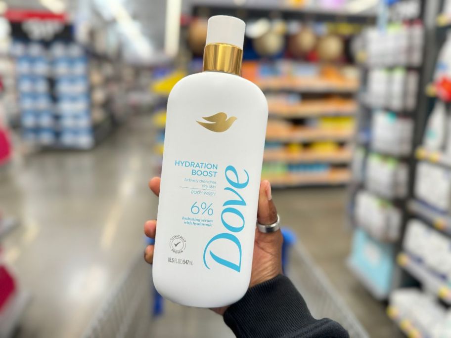 dove serum body wash being held up in store aisle