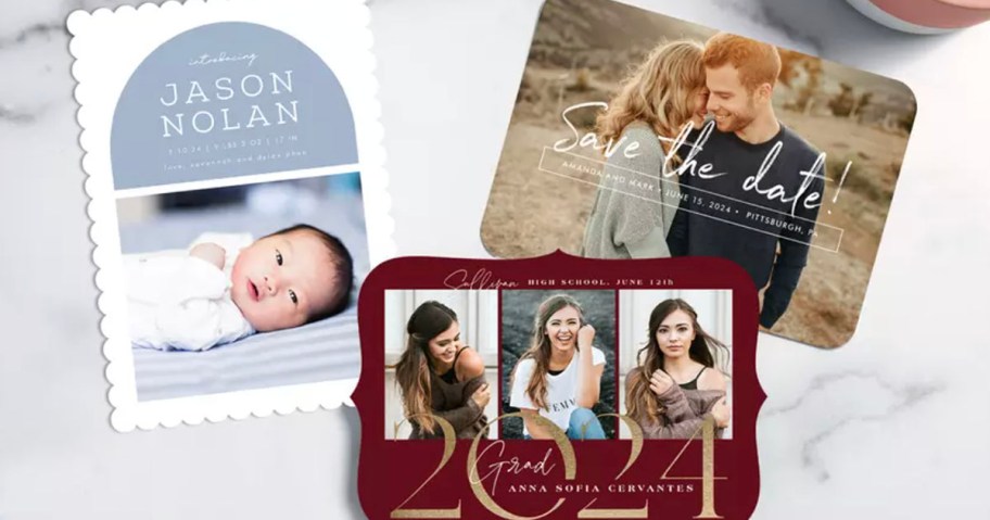 birth annoucement, graduation, and save the date photo cards laying on marble countertop