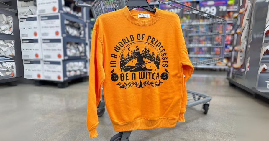 halloween sweatshirt hanging on cart in store