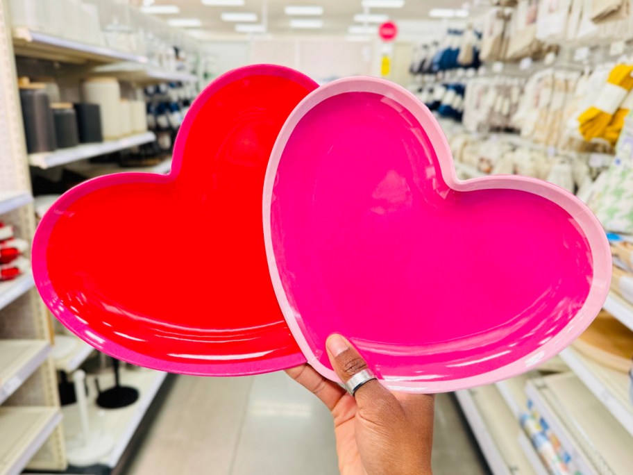 hand holding heart plate in red and pink