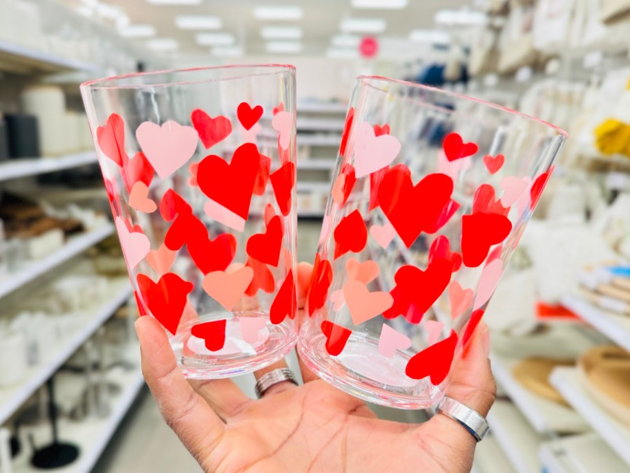 hand holding heart tumbler