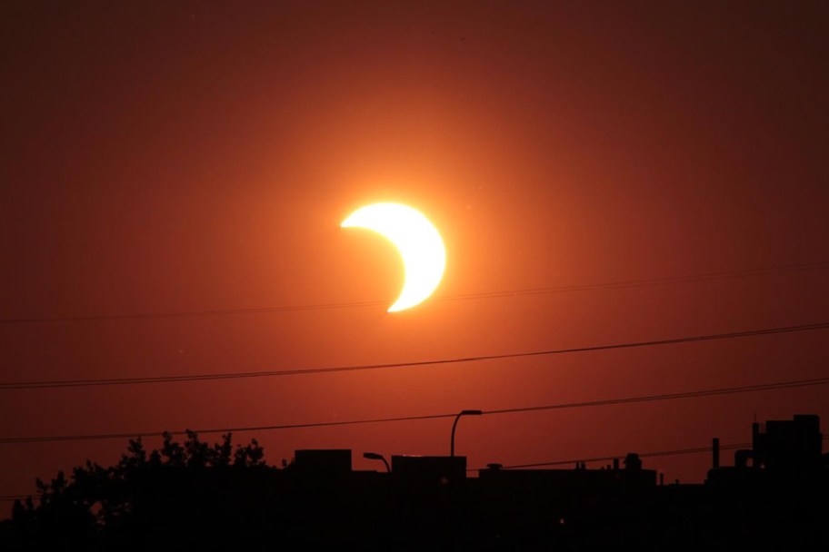 moon partially blocking the sun to look like a crescent shape