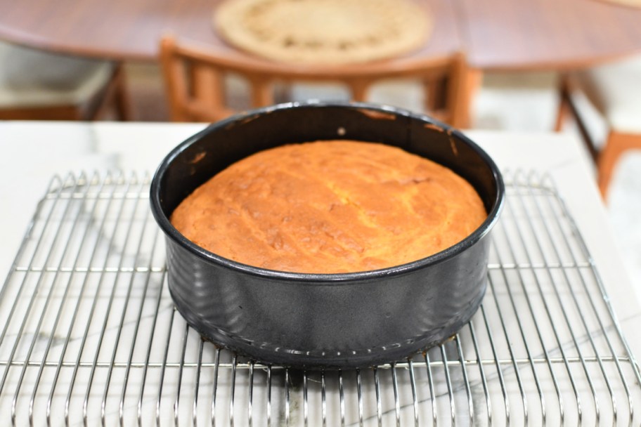 pineapple upside down cake cooling on a metal rack