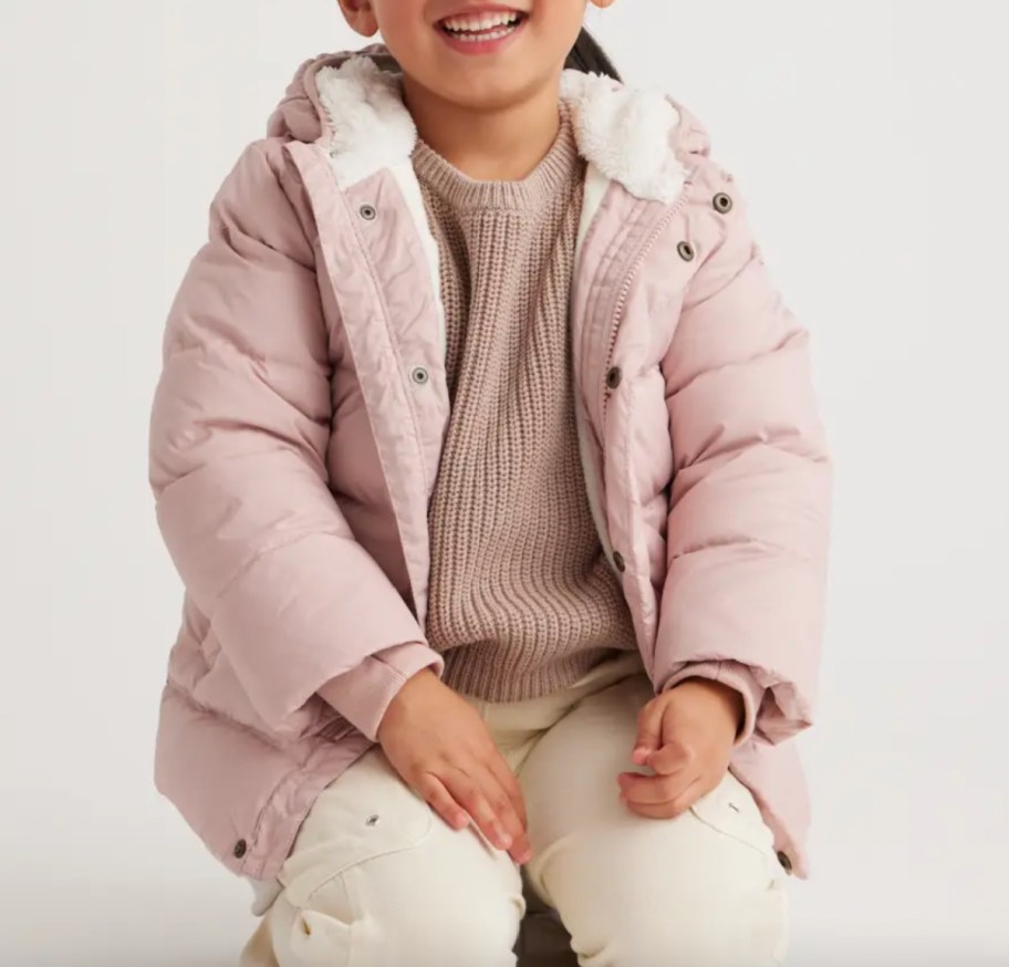 girl in light pink puffer jacket