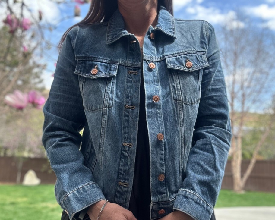 denim jacket over black dress