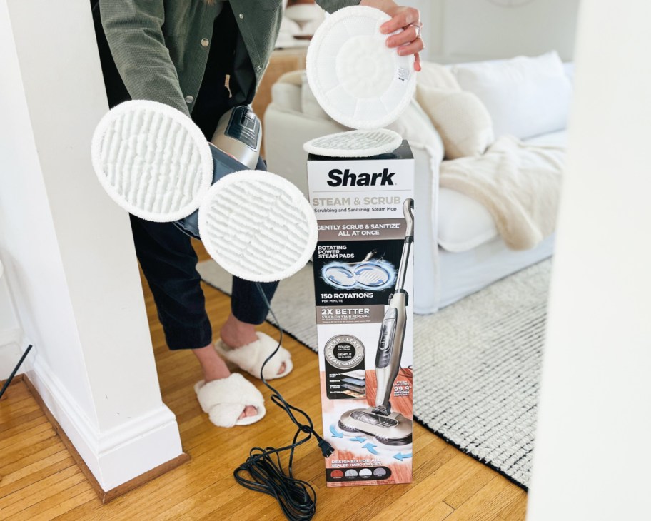 shark mop in box with woman holding scrub pads