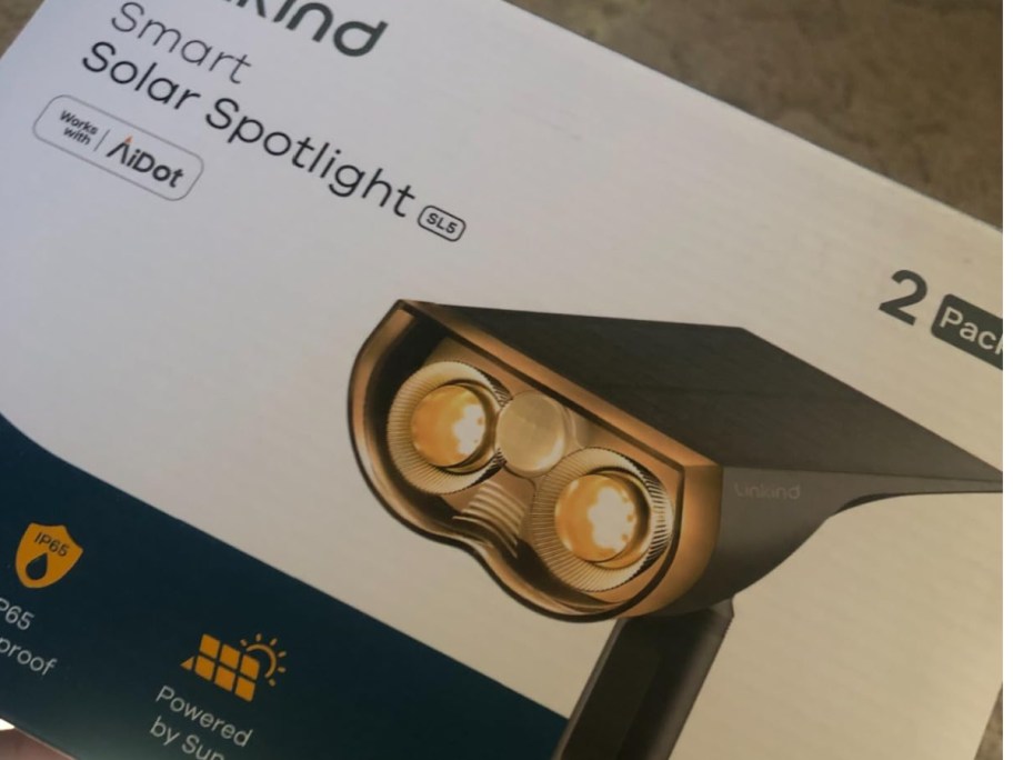 smart solar light fixture inside of its box