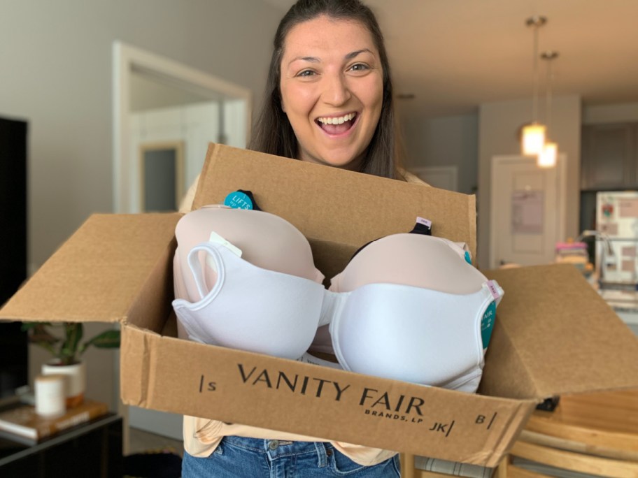 woman holding vanity fair box with bras in it