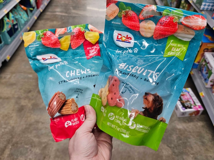 hand holding Dole brand pet treats