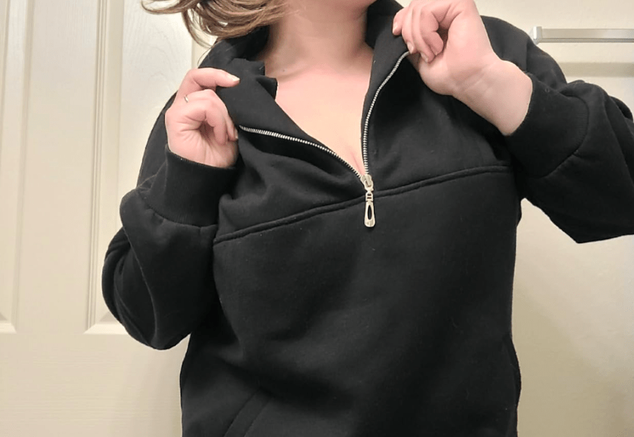 woman wearing oversized black sweatshirt 