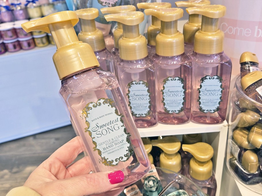 hand holding a bottle of Bath & Body Works Sweetest Song Hand Soap