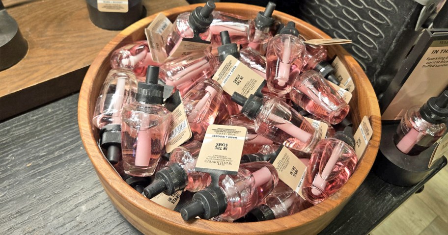 wood bowl filled with pink Bath & Body Works Wallflower Refills