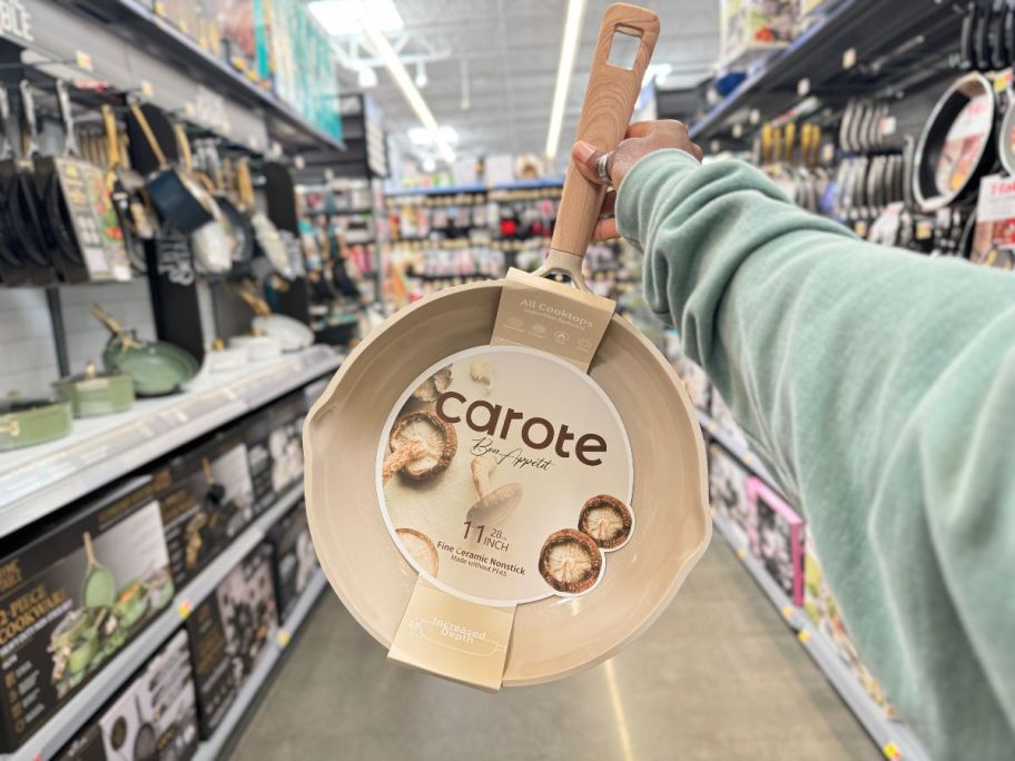 A person holding a Carote 11 Ceramic Nonstick pan