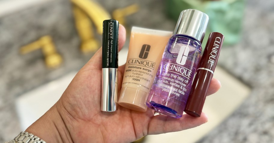 4 travel-size clinique products in hand