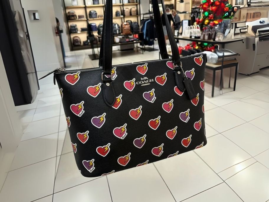 Coach Gallery Tote Bag w/ Heart Bolt Print in hand in store