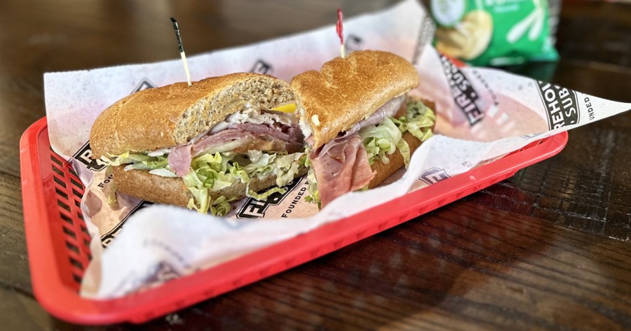 firehouse sub in red basket on table