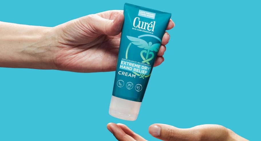 Hand holding a Curel Extreme Dry Hand Relief cream