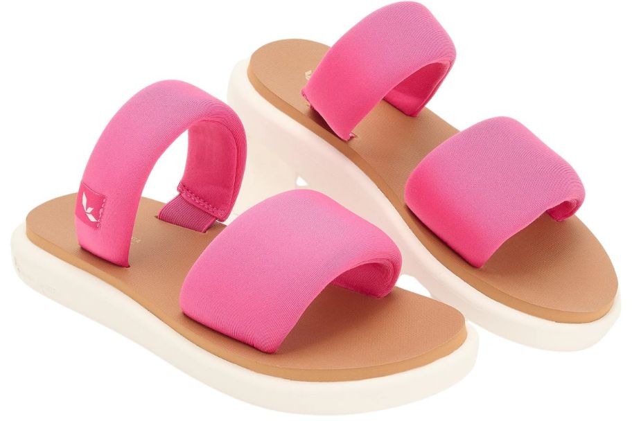 A pair of pink Ugg sandals 