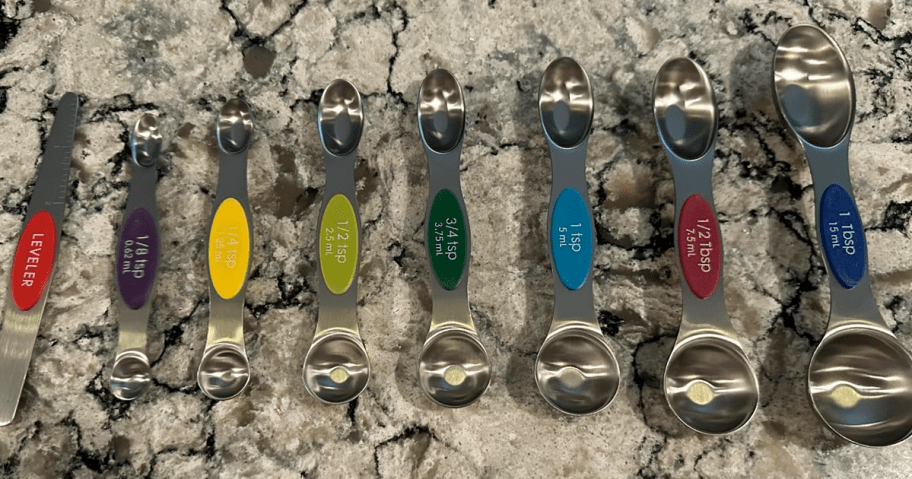 Magnetic Measuring Spoons spread out on a marble countertop 