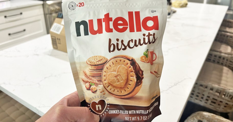 hand holding a bag of Nutella Biscuit Cookies in kitchen