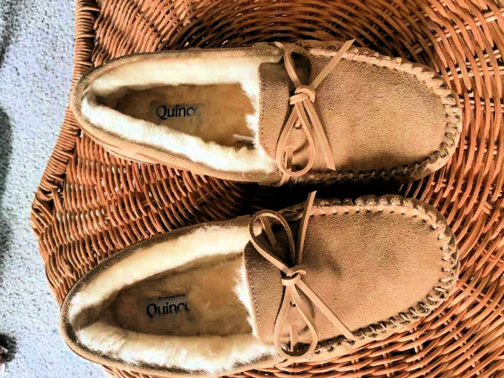 tan quince moccasin slippers in basket