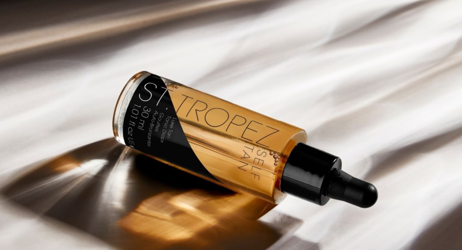 St. Tropez tanning oil displayed on top of a table