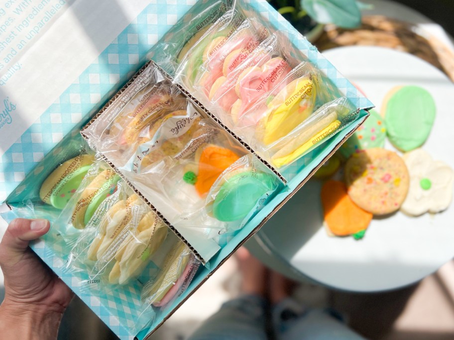 box filled with cheryls cookies and a tray next to it