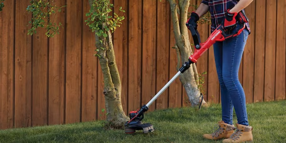 woman holding craftsman weed trimmer 