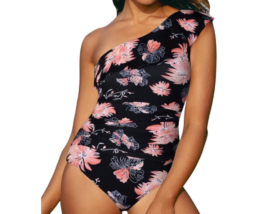woman in one shoulder blue and pink floral swimsuit
