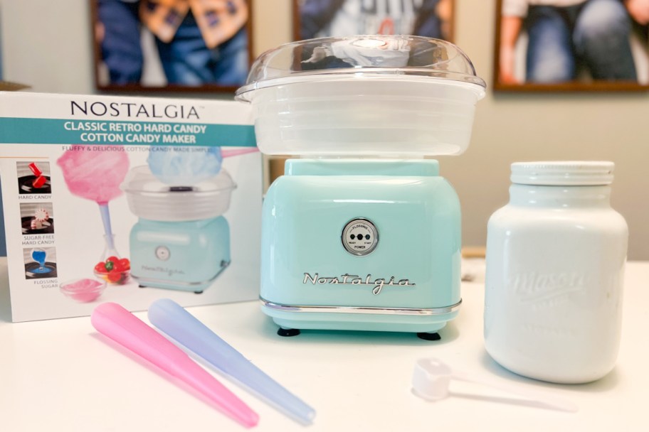 nostalgia cotton candy maker next to box