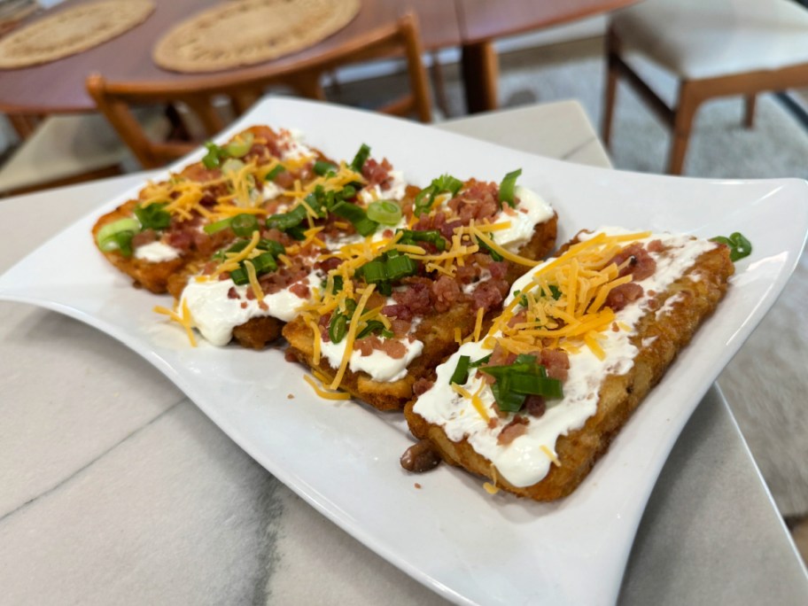 plate of loaded hash browns on the counter