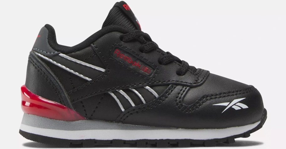 black, red, and white reebok kids shoe