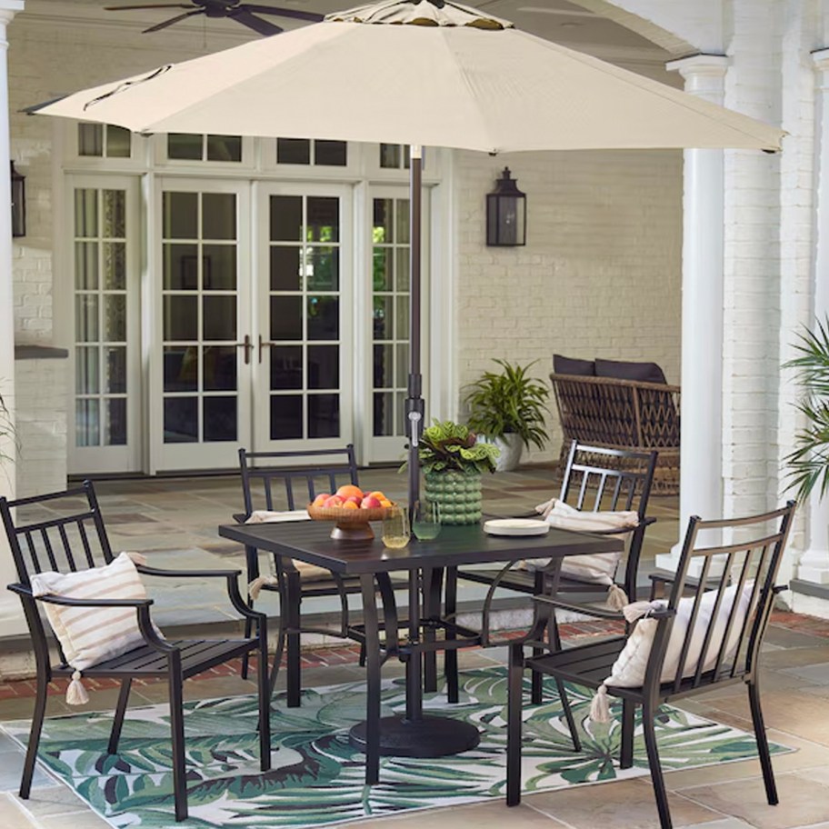 tan and black patio dining set 
