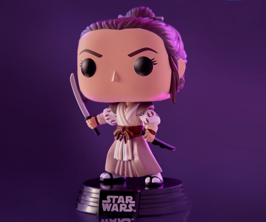Princess Leia figurine on a purple background