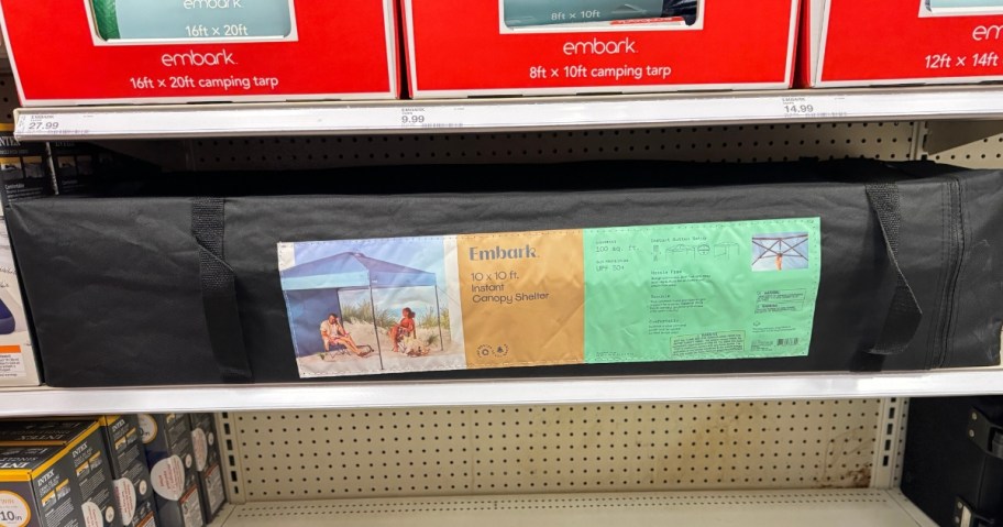 large canopy tent in carry bag and packaging on store shelf