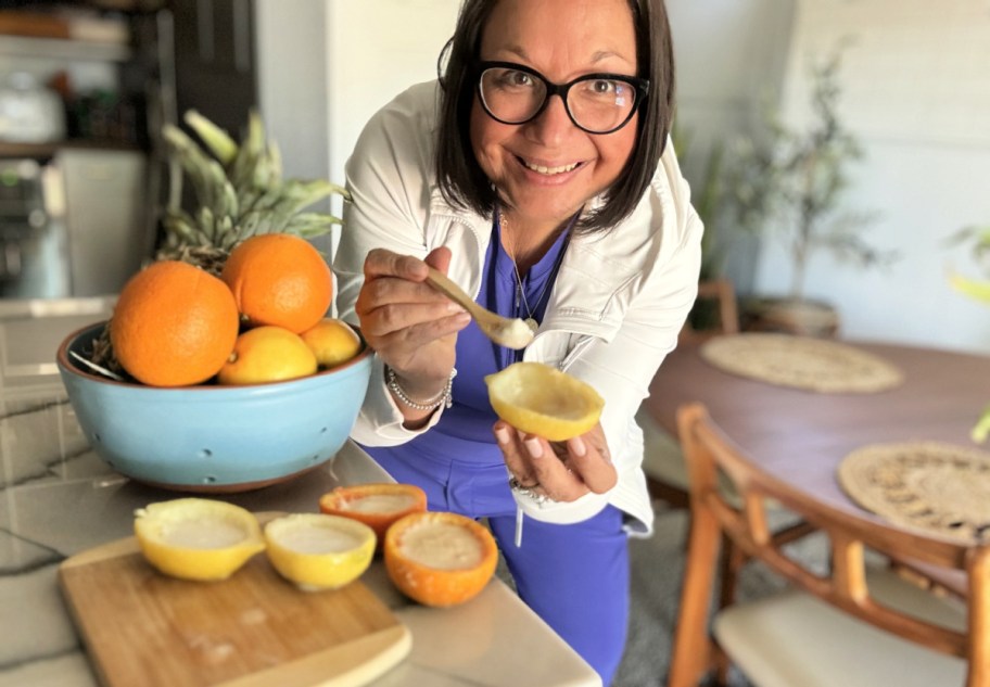 woman holding a fresh lemon sorbet