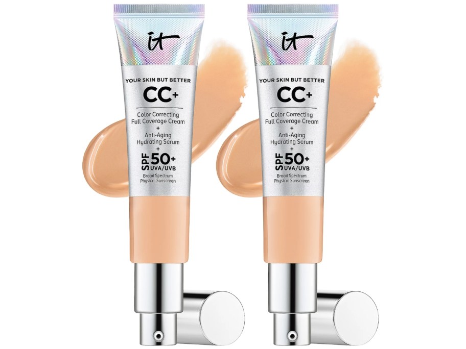 2 tubes of IT Cosmetics CC Cream with SPF 50 with the cream spread out behind it