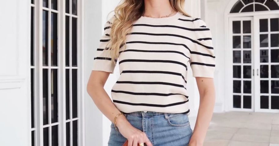 Woman wearing a Haeof Women's Striped Puff Short Sleeve Tee