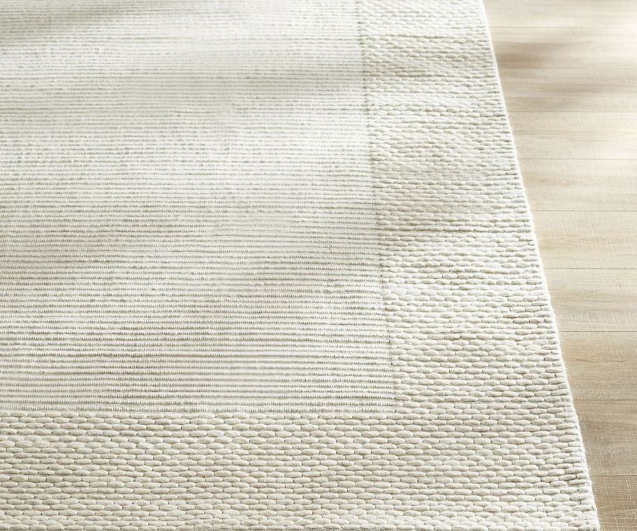 an ivory flatweave rug