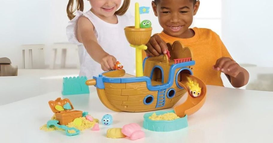 kids playing with Baby Shark Ultimate Shipwreck Play Set