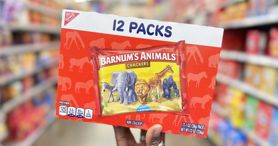 hand holding up red box of Barnum's Original Animal Crackers