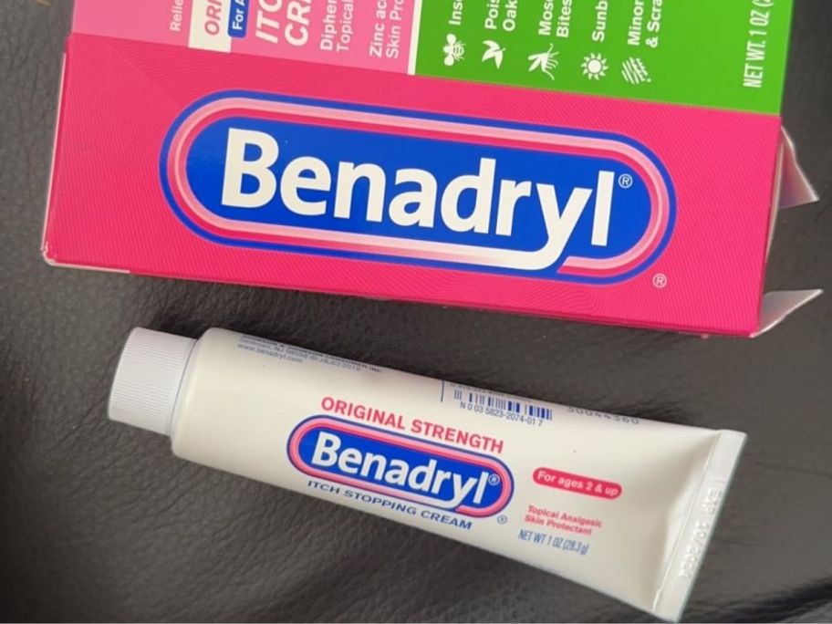 A tube of Benadryl Cream next to the box it onlinees in