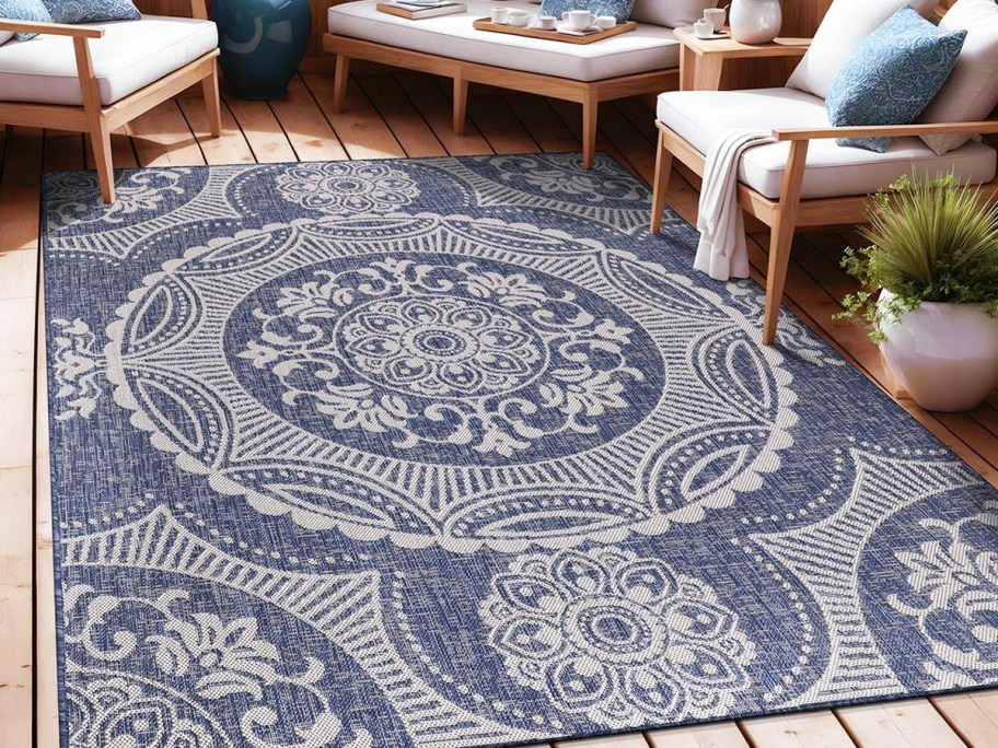 blue and white medallion area rug on patio