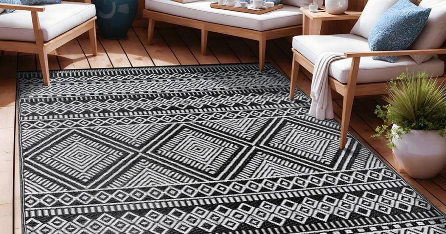 black and white geometric area rug on patio