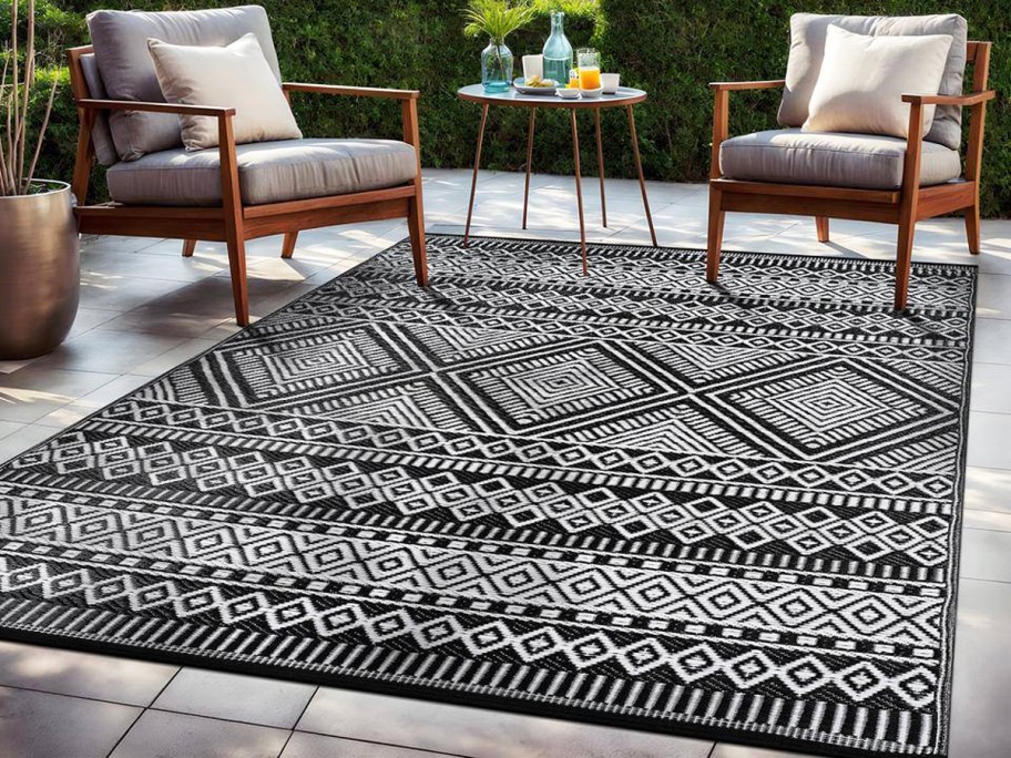 black and white geometric area rug on patio